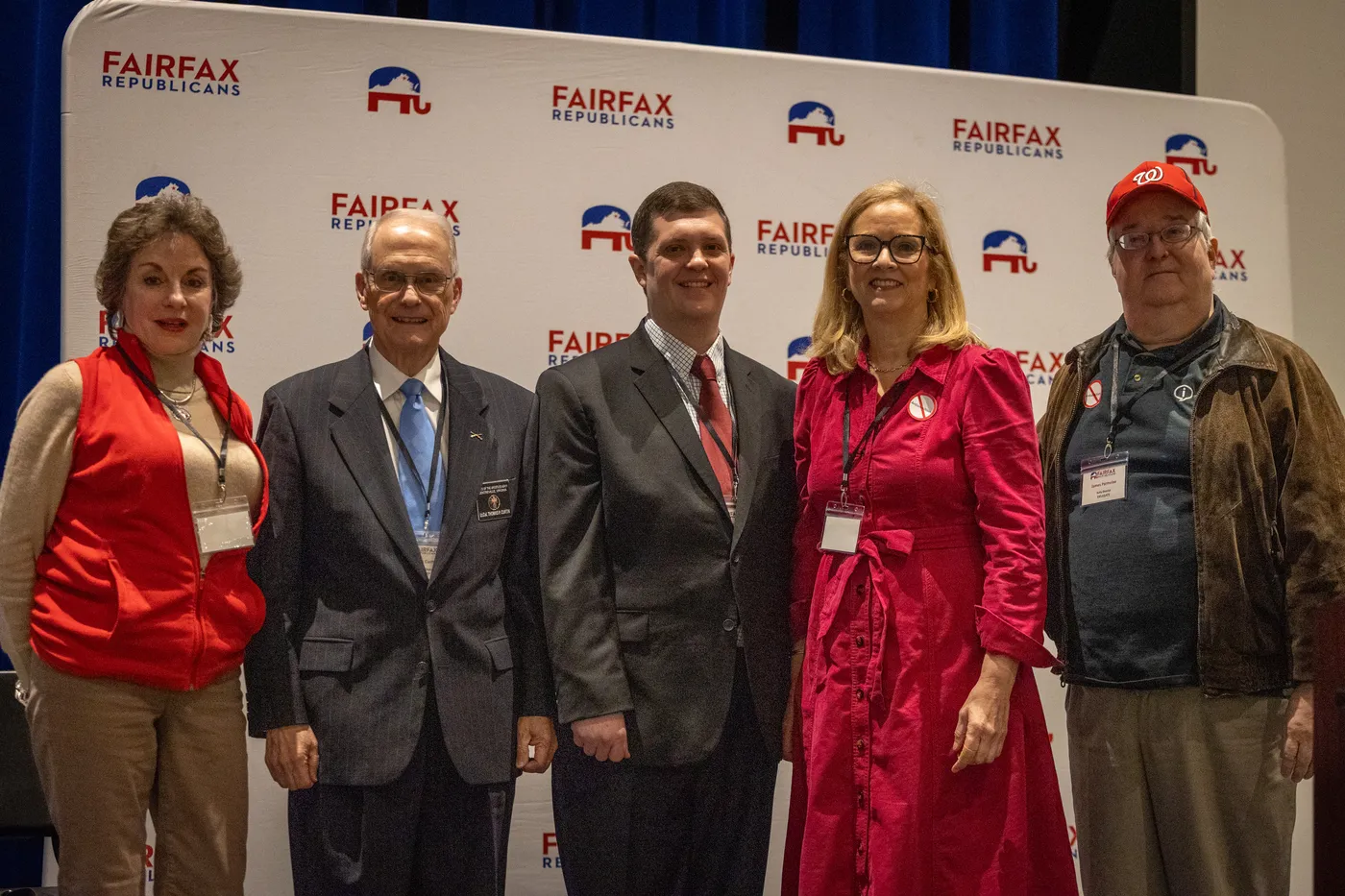 Fairfax Republicans stand together before the Fairfax Republicans backdrop at the 2026 County Convention.